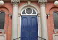 Panelled double doors and fan light